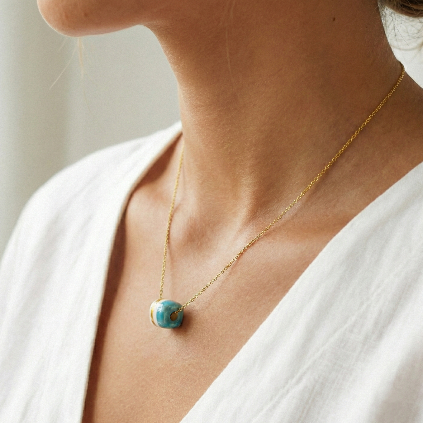 Pendant with cube. Tile print in blue and gold