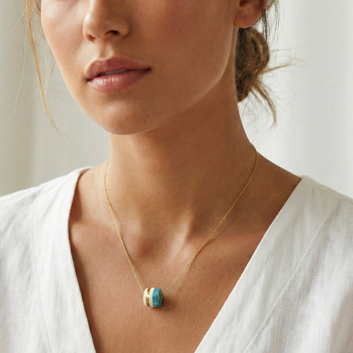 Pendant with cube. Tile print in blue and gold