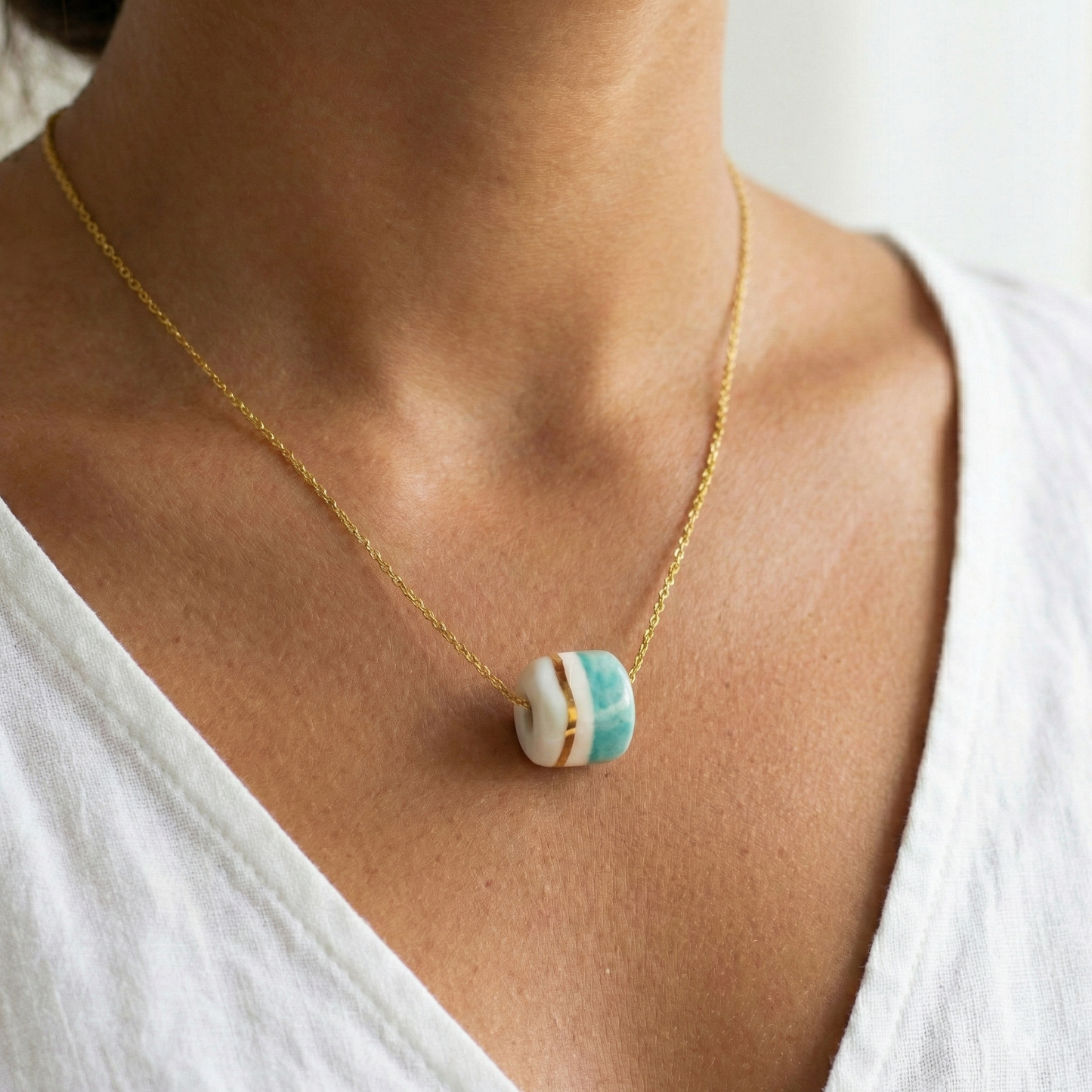 Pendant with cube. Tile print in blue and gold