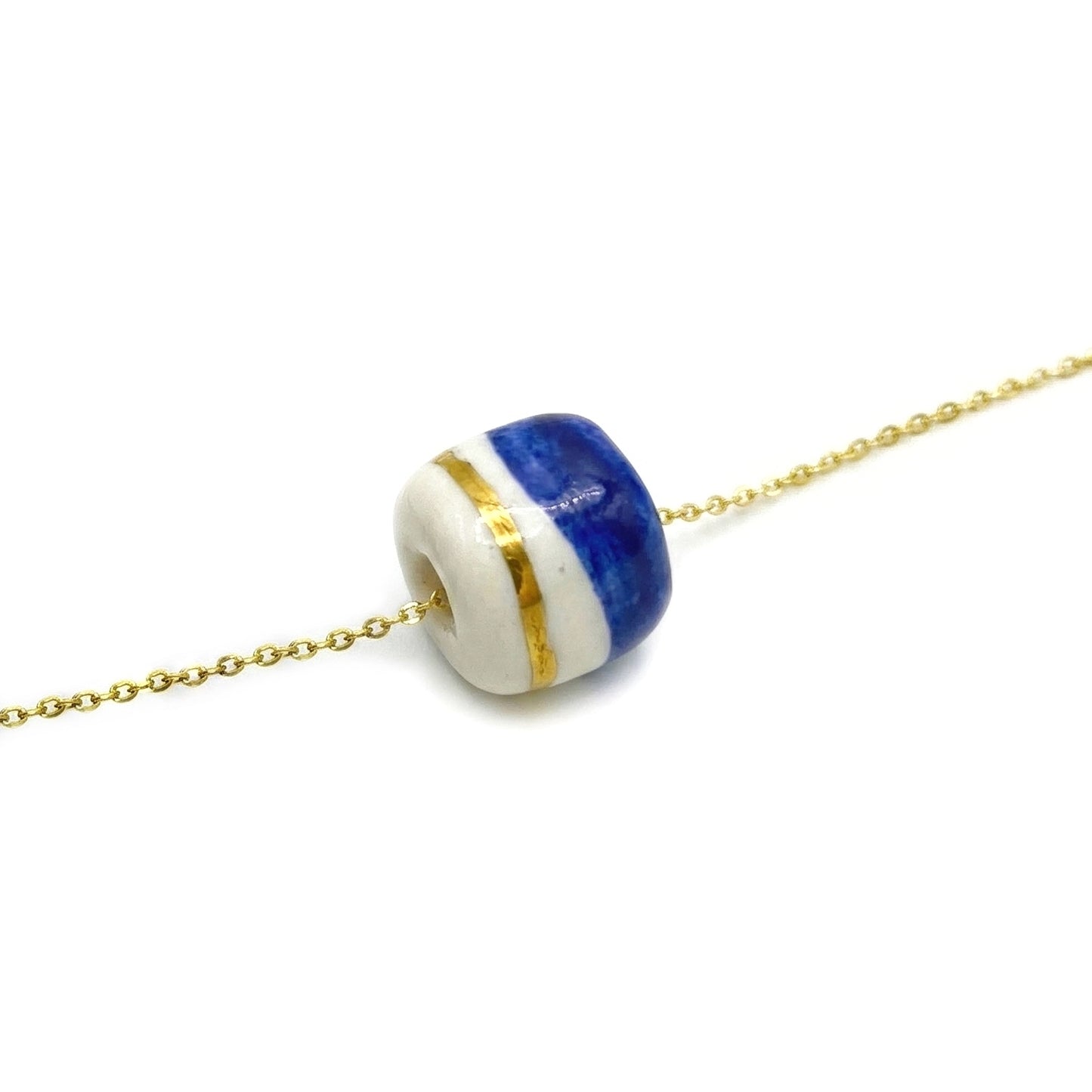 Pendant with cube. Tile print in blue and gold