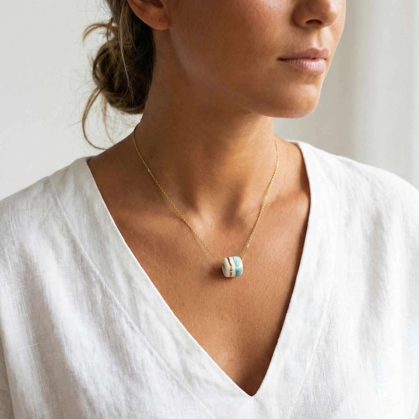 Pendant with cube. Tile print in blue and gold