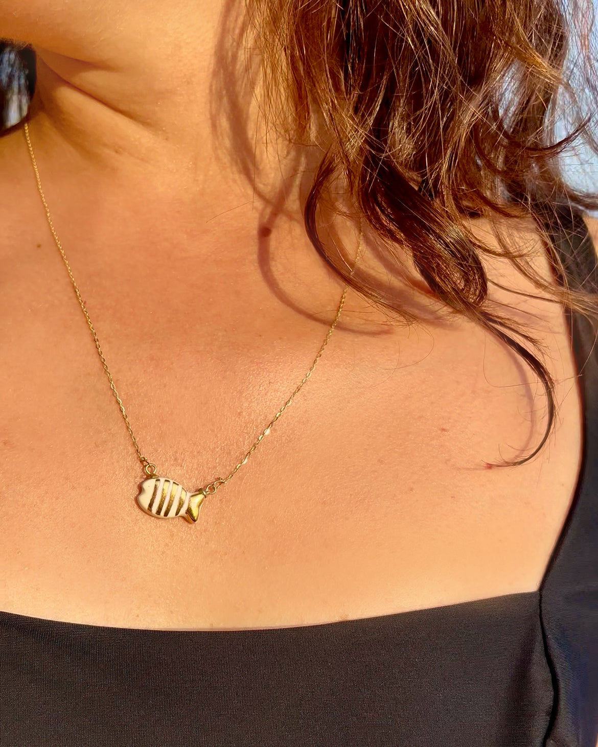 Collana con Pesciolino a strisce oro