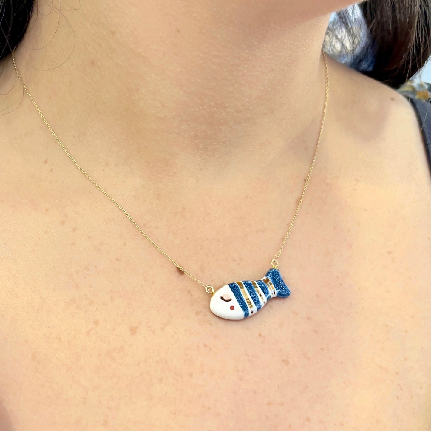 Classic gold and blue striped fish necklace