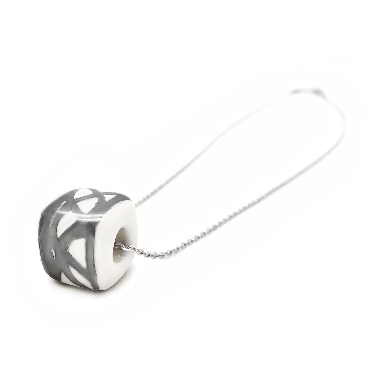 Ceramic pendant with white and platinum abstract decoration 