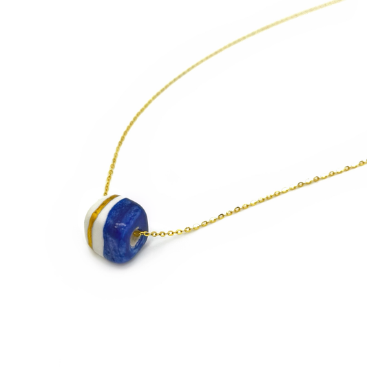Pendant with cube. Tile print in blue and gold