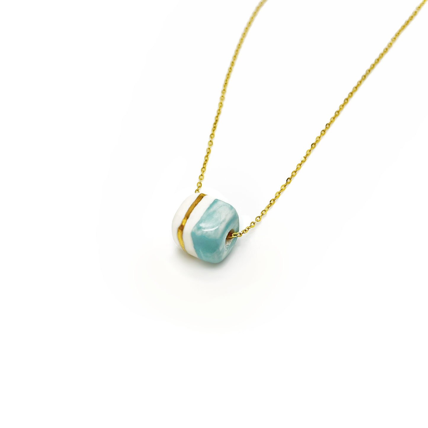 Pendant with cube. Tile print in blue and gold