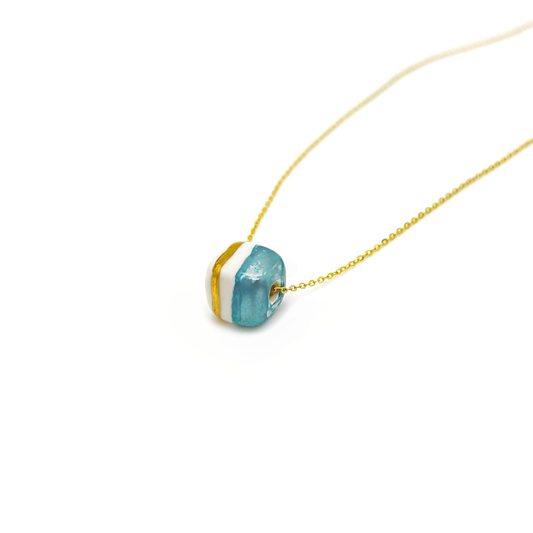 Pendant with cube. Tile print in blue and gold