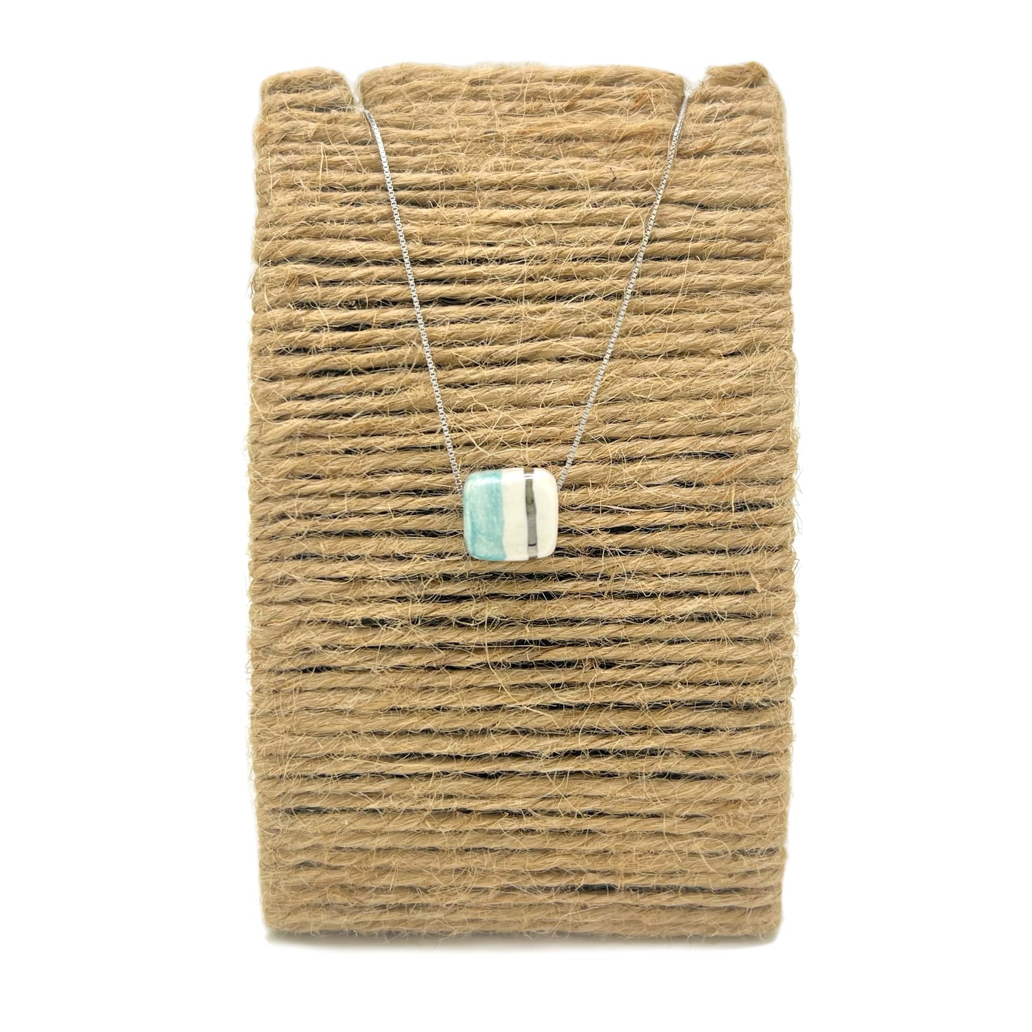 Colgante con estampado Tile cube azul y dorado
