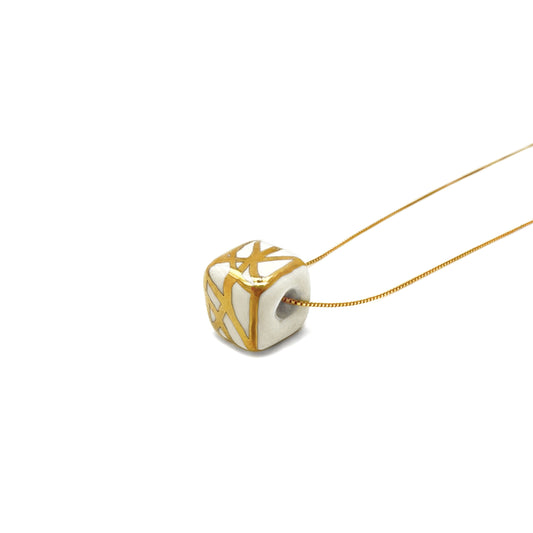 Pendant with abstract gold decoration