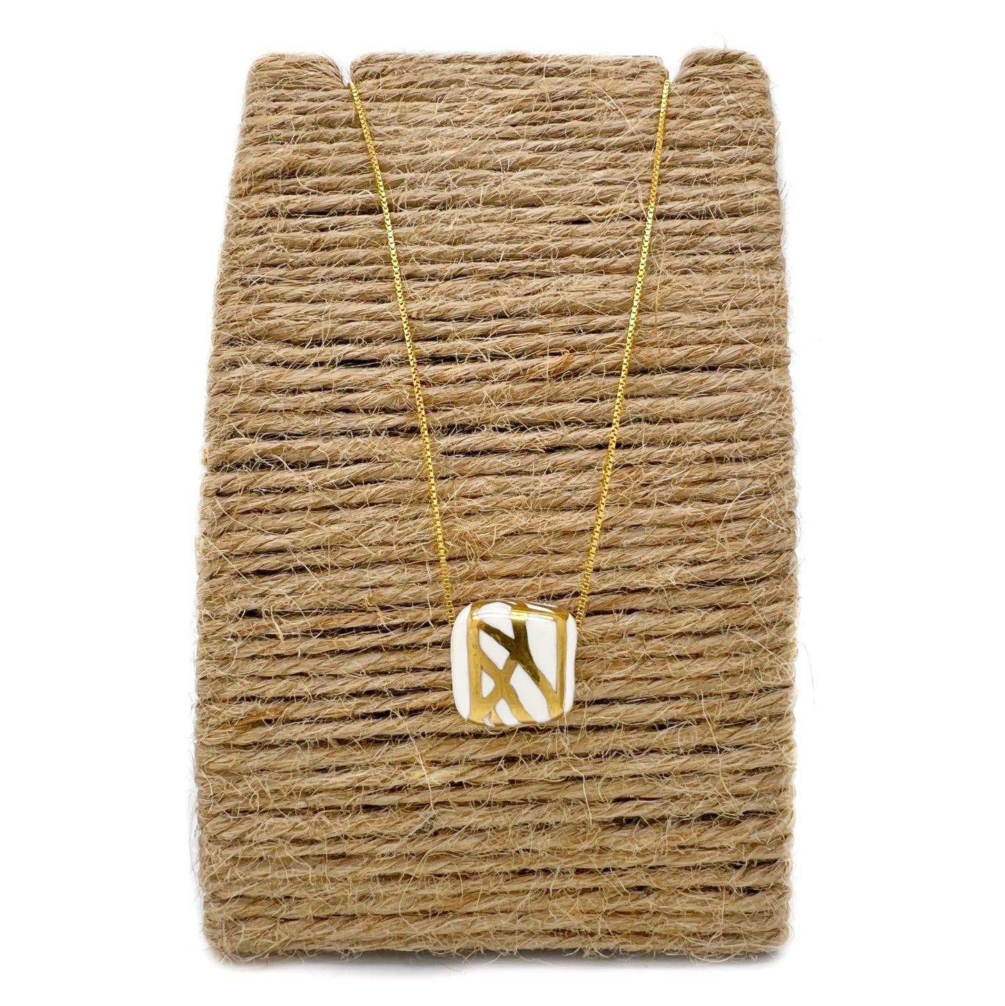 Pendant with abstract gold decoration