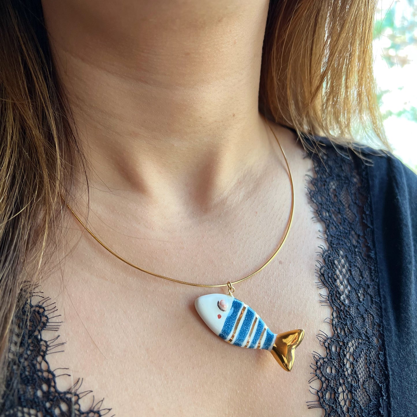 Classic gold and blue striped fish necklace
